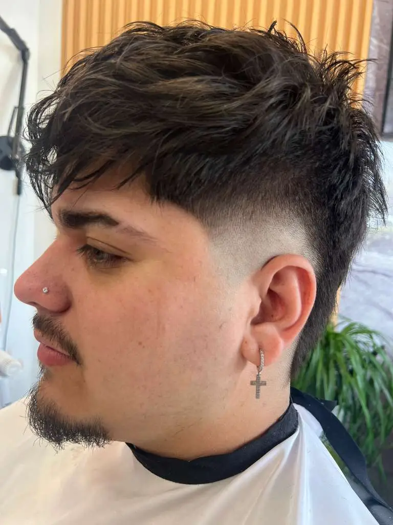 Low fade with textured top at Ludmi Barber Davie FL
